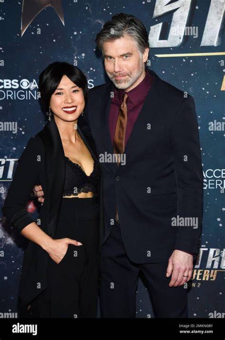 Anson Mount and Darah Trang with their pet dogs during Christmas