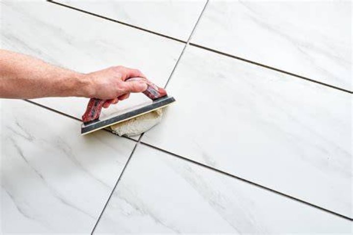 Can you grout floor tile the same day?