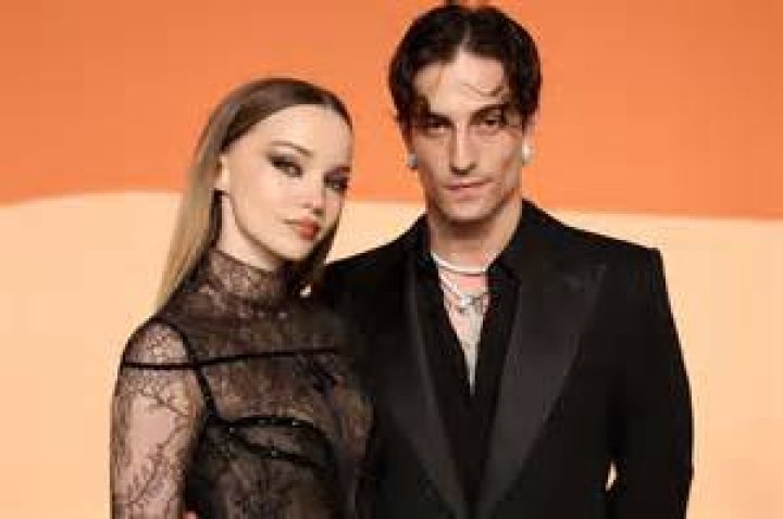 Dove Cameron cuddling her boyfriend, Thomas Doherty