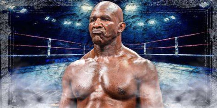 Evander Holyfield with his former wife Candi Calvana Smith posing for the photoshoot