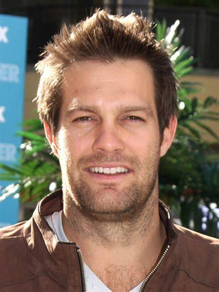 Geoff Stults is posing for the photo.