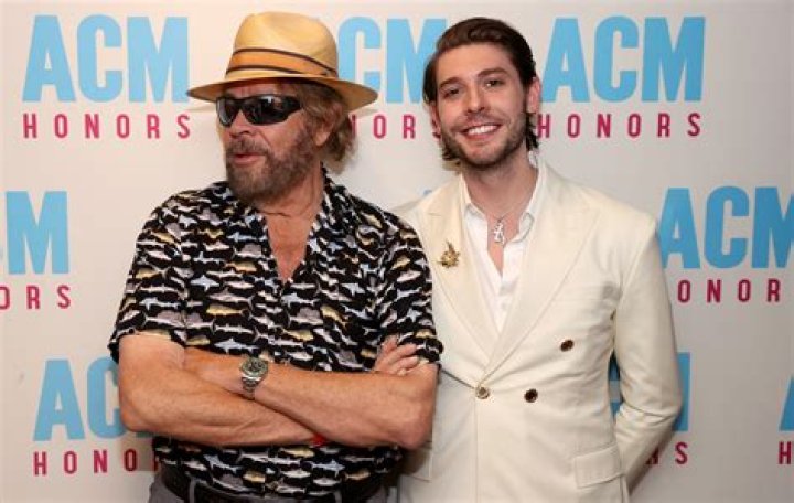 Hank Williams Jr with his pet mountain lion on the cover of his album Strong Stuff
