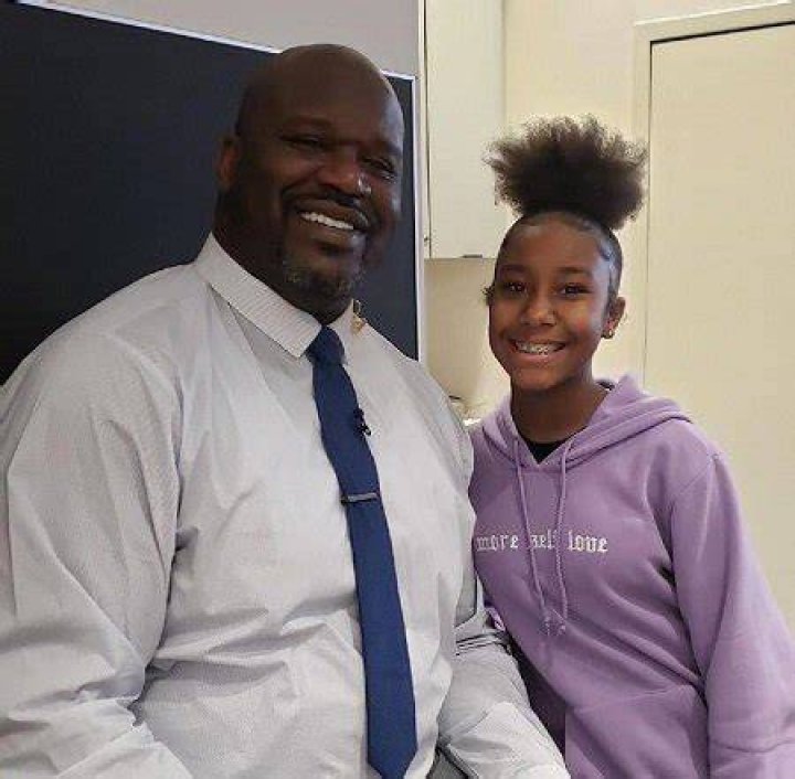 Jalaiah Harmon posing alongside DR. SHAQUILLE O'NEAL.