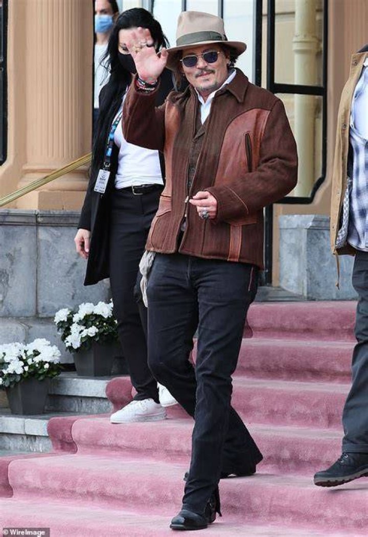 Johnny Depp leaves his hotel smoking a cigarette in Warsaw