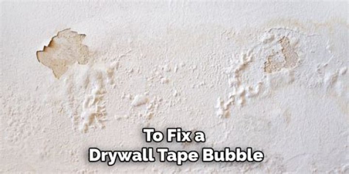 What causes drywall to bubble?