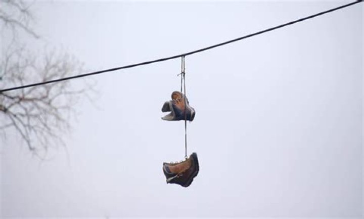 What does shoes hanging on a wire mean?